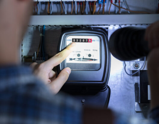 Finger Pointing To Electric Meter Reading